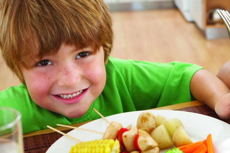 Boy eating healthy school food